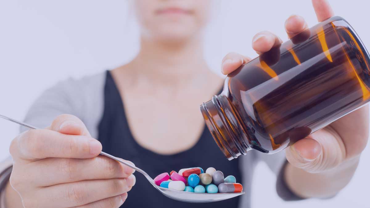 Woman with medications and bottle